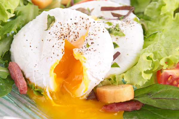 Poached Eggs with Garlic Croutons on Spring Mix